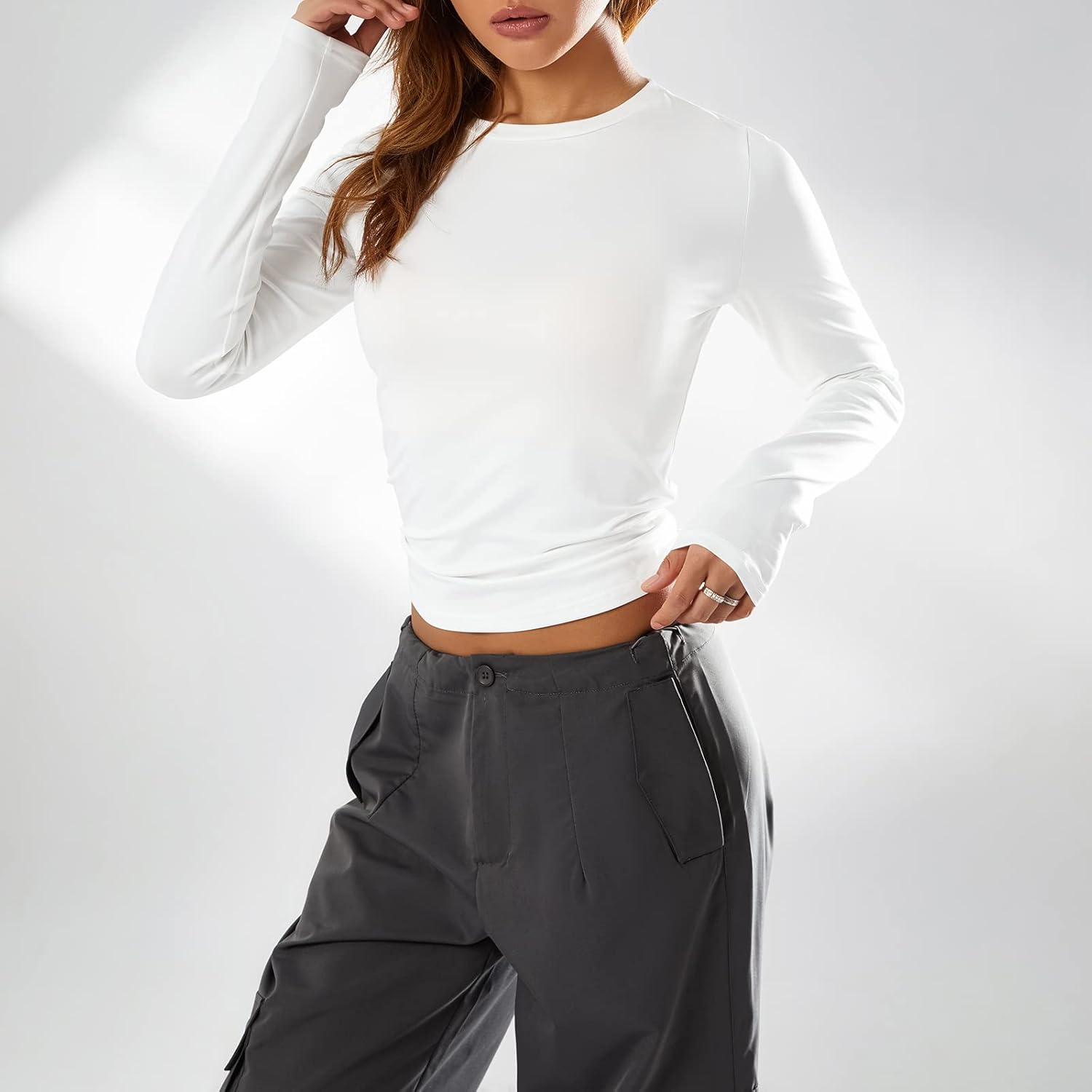 Collection of Trendy Slim Fit Long Sleeve Crop Top for Women - Solid Color Crew Neck Tee, Perfect for Going Out & Everyday Streetwear in a gallery layout