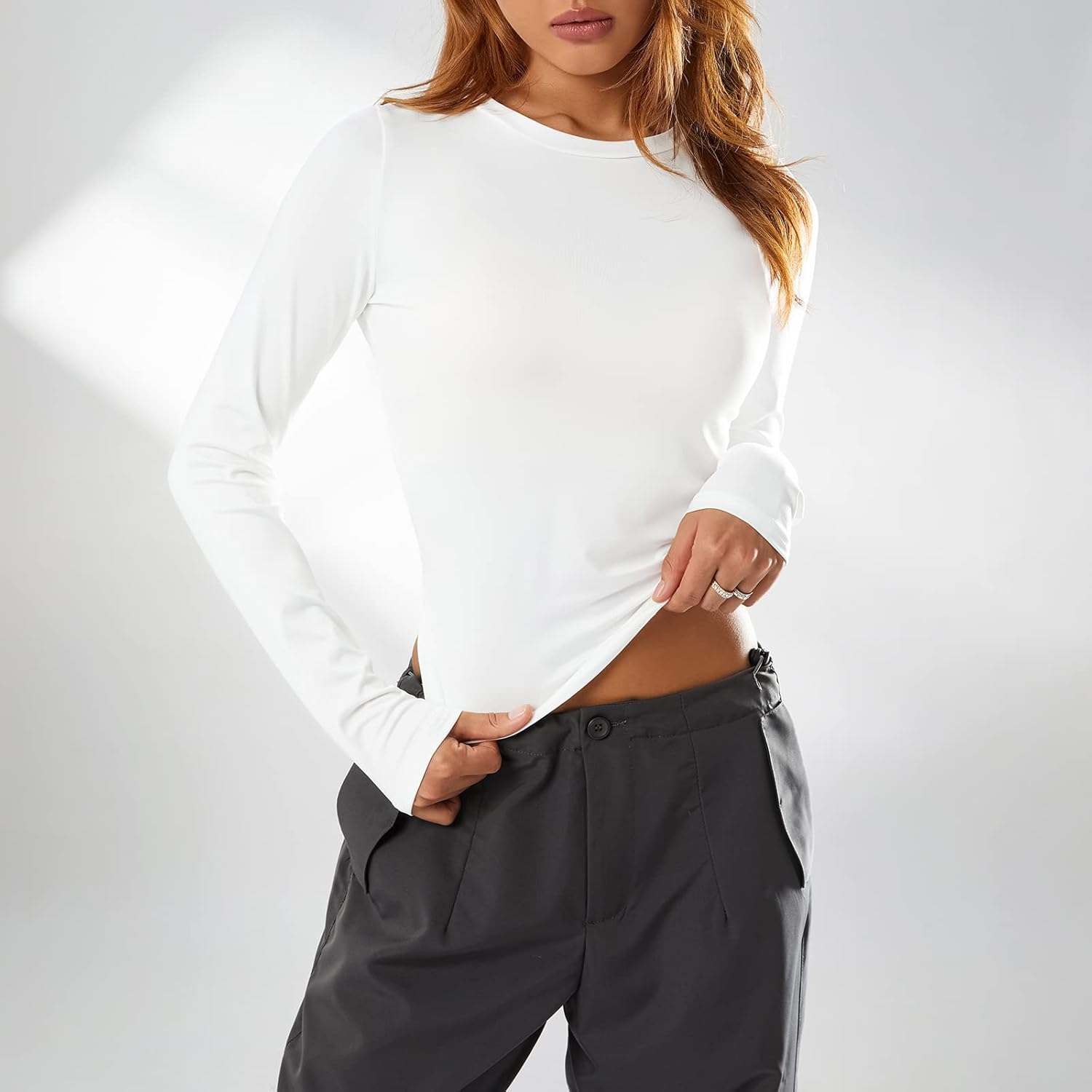 Collection of Trendy Slim Fit Long Sleeve Crop Top for Women - Solid Color Crew Neck Tee, Perfect for Going Out & Everyday Streetwear in a gallery layout